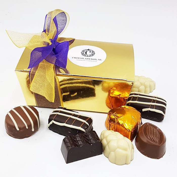 125 grammes de bonbons belges dans une luxueuse boîte à bonbons dorée